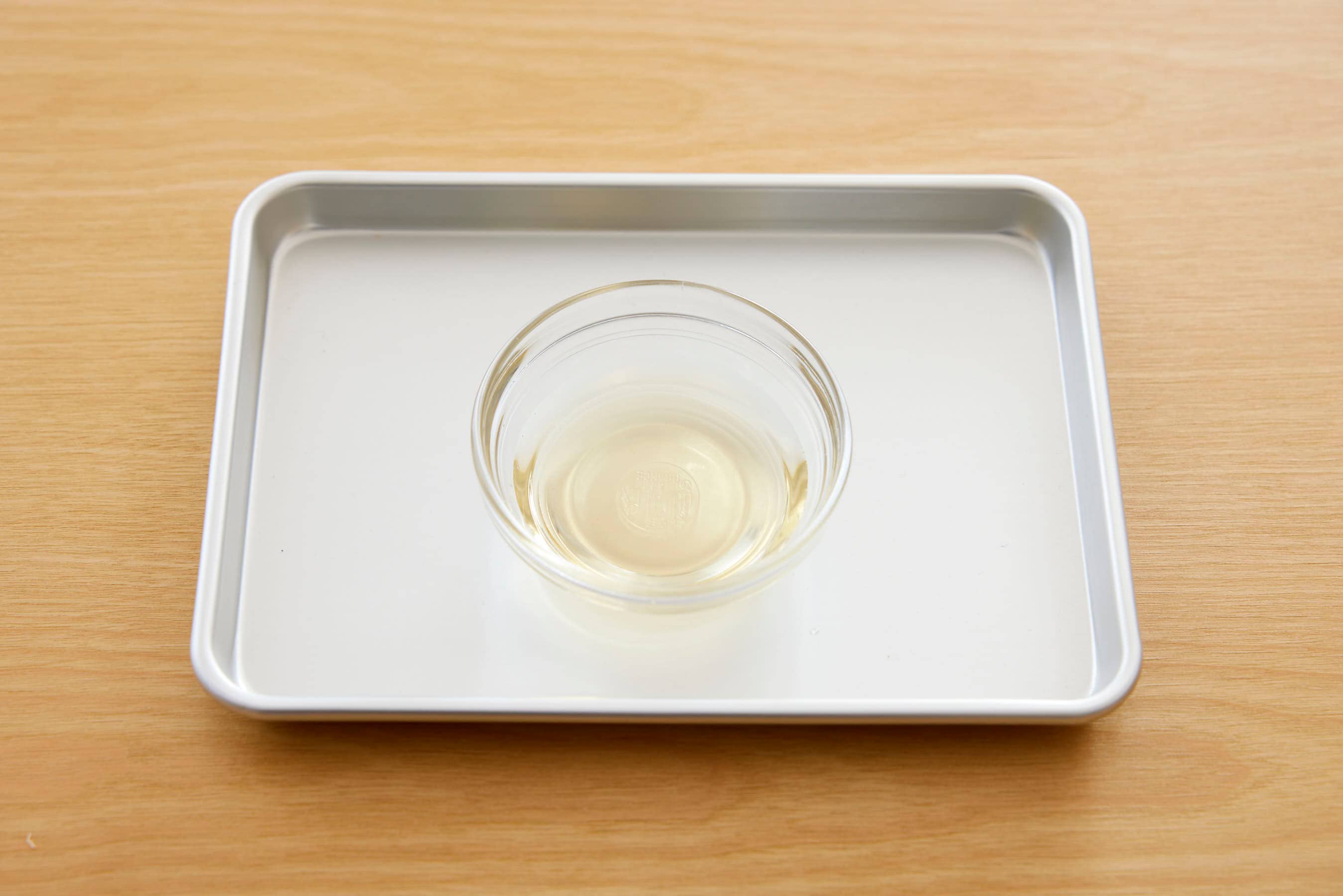 A bowl of vinegar on a trey
