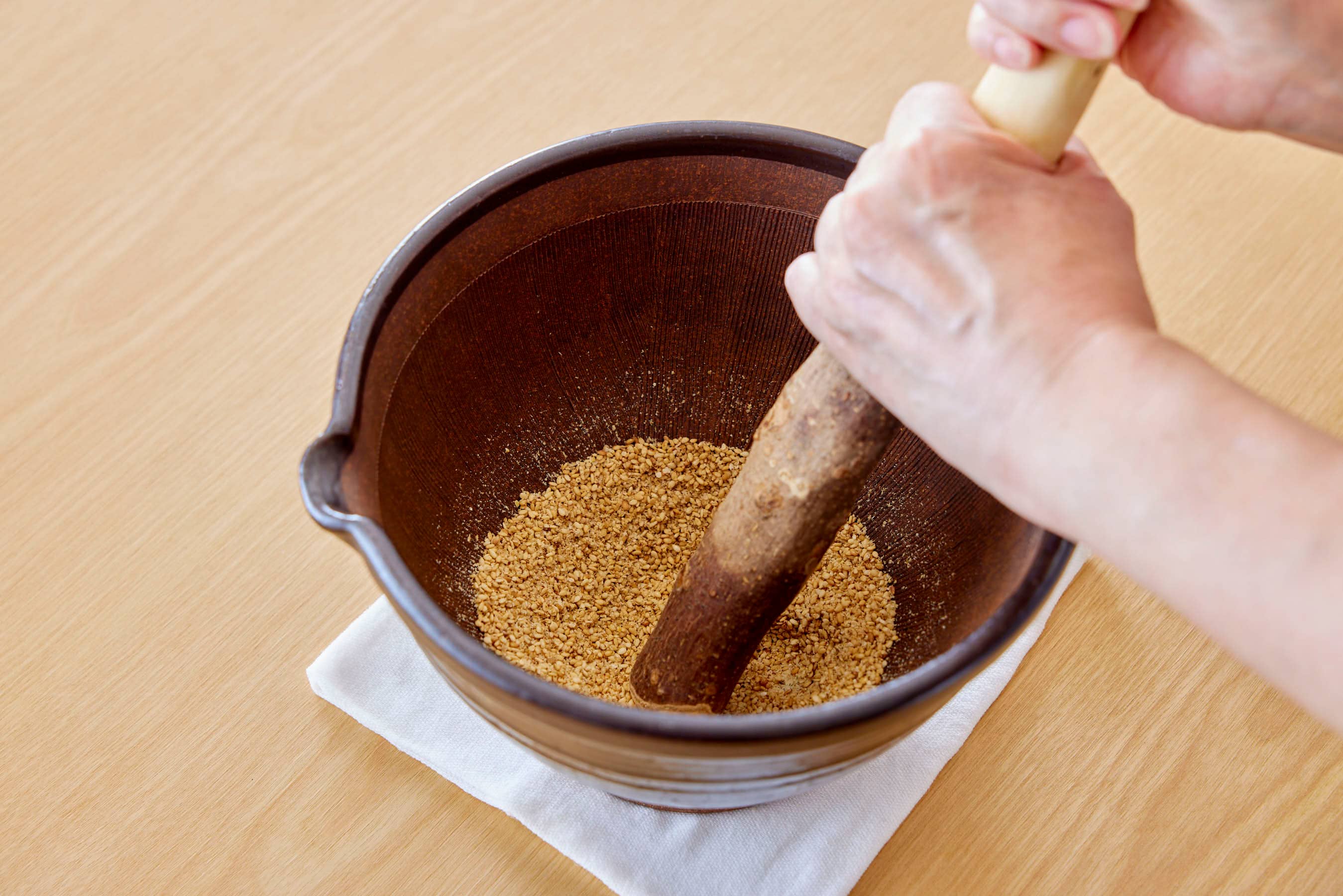 Grinding sesame seeds