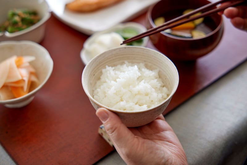 Holding a rice bowl