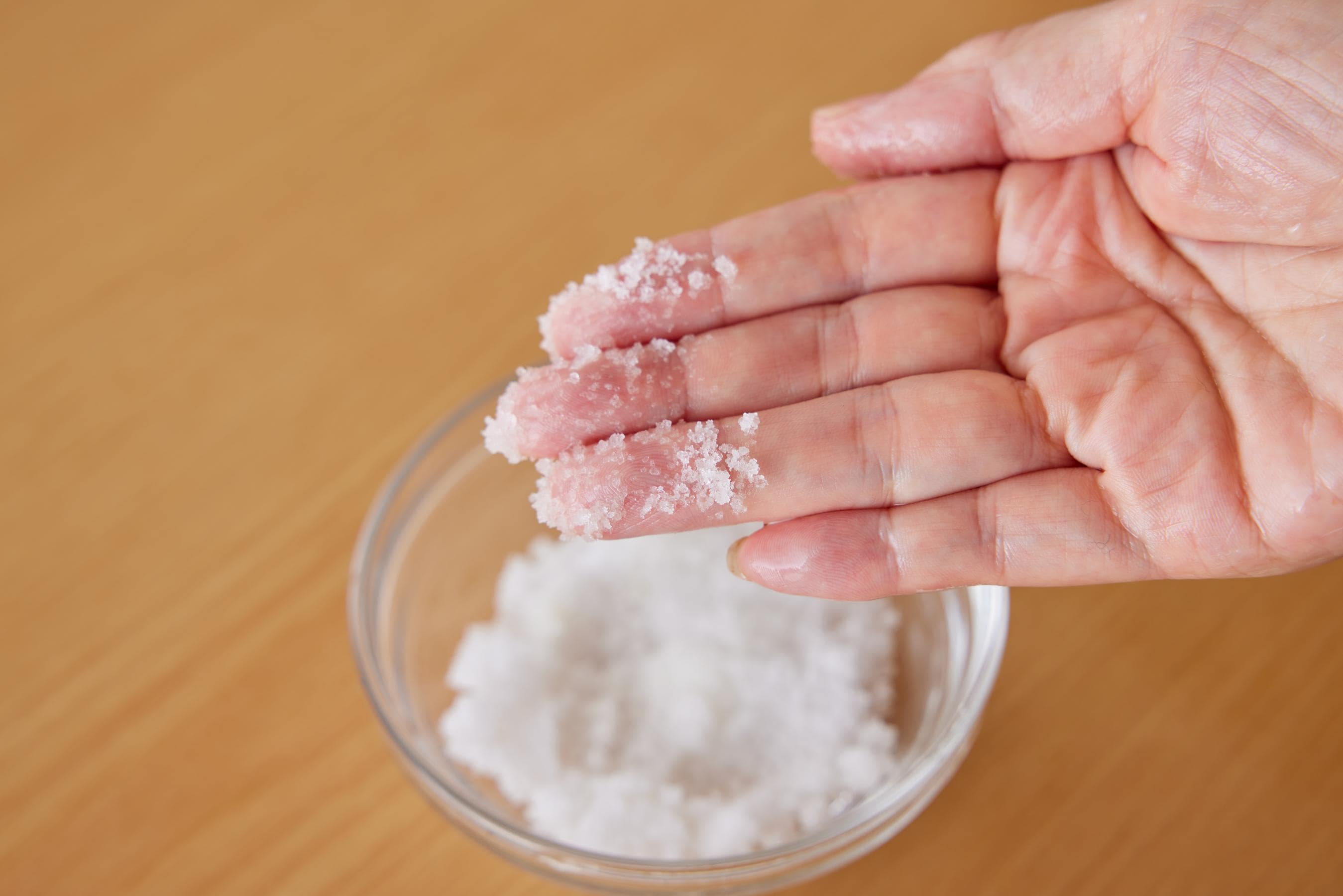 putting a little salt on fingertips