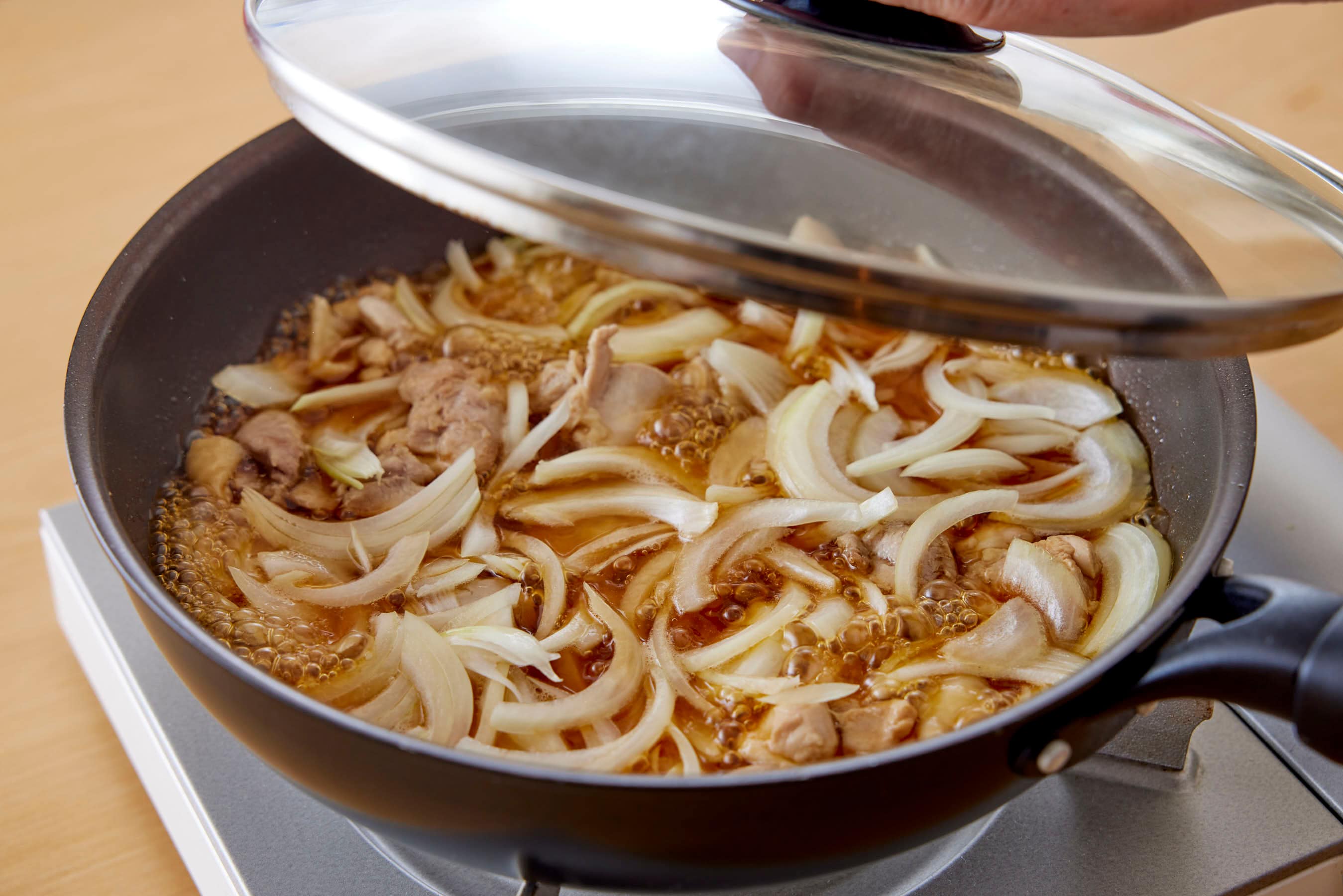Cooking onion in a broth