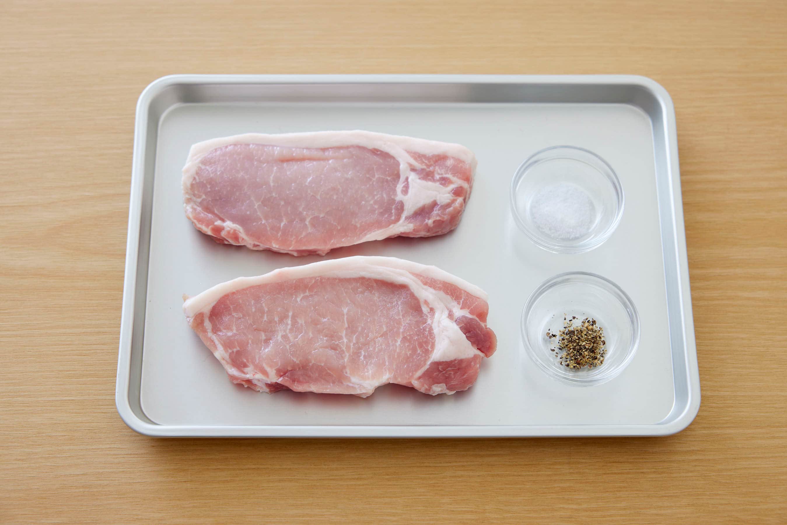 Pork loin, salt and pepper on a trey