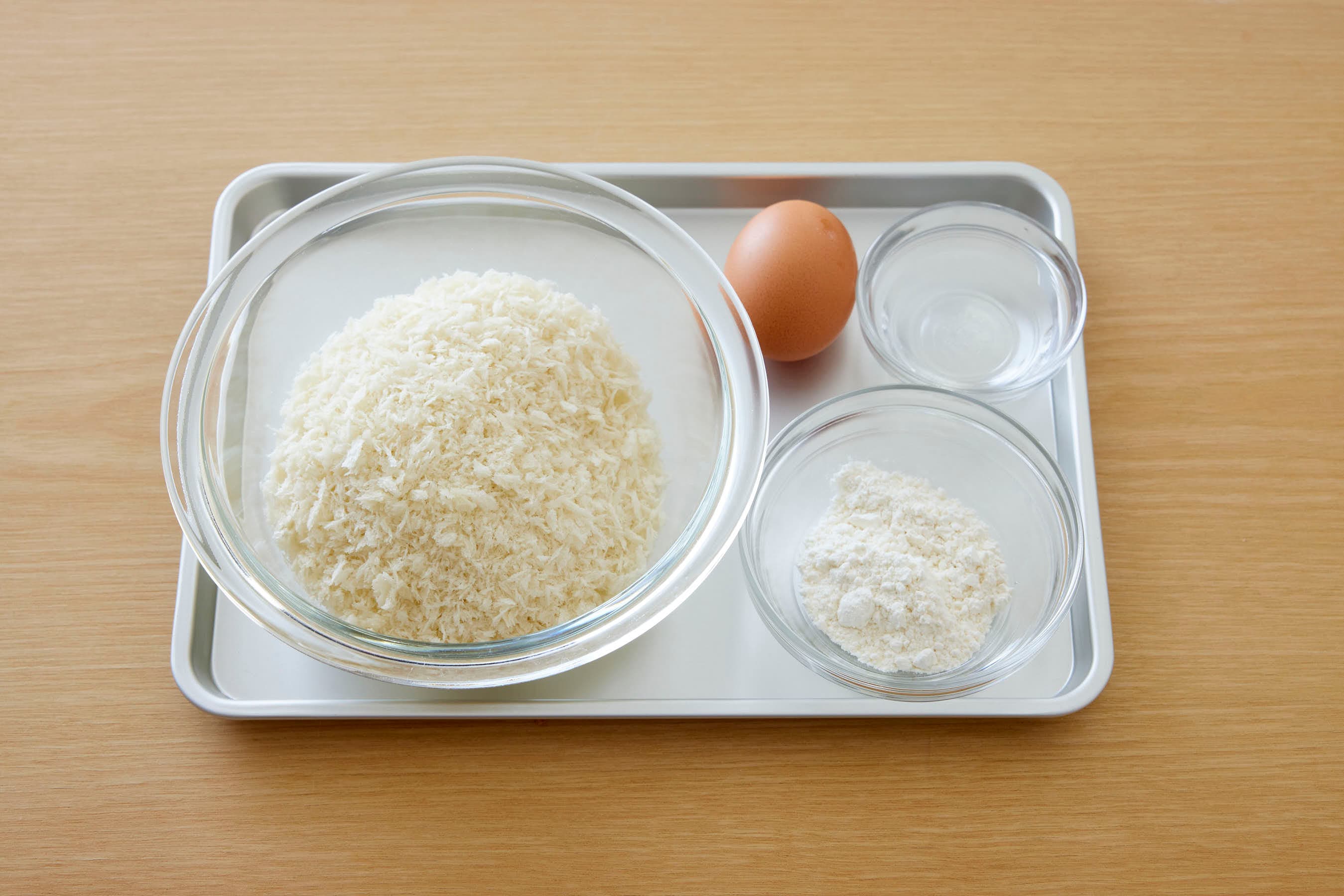 Egg, water, flour and panko on a trey