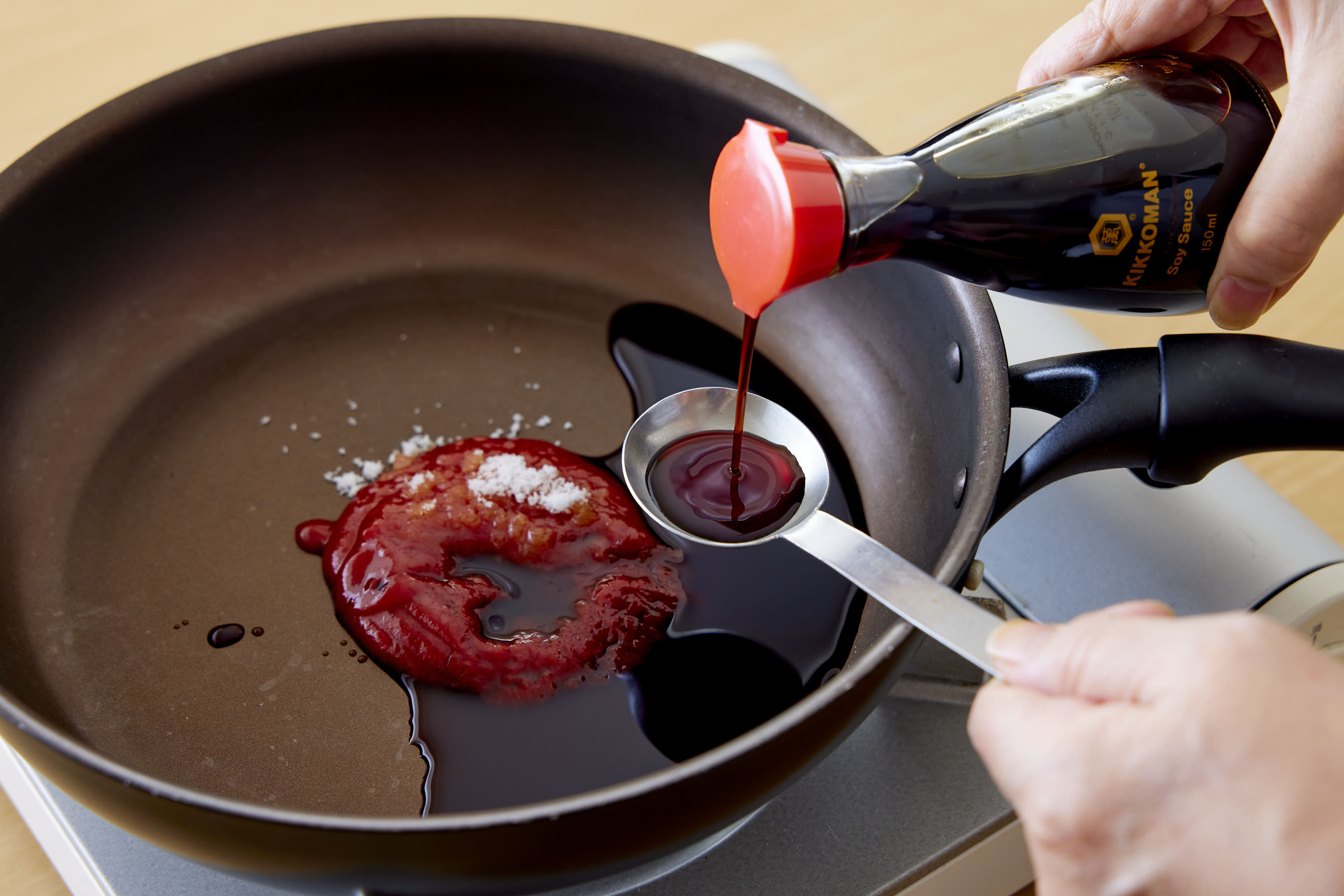 Adding Kikkoman Soy Sauce