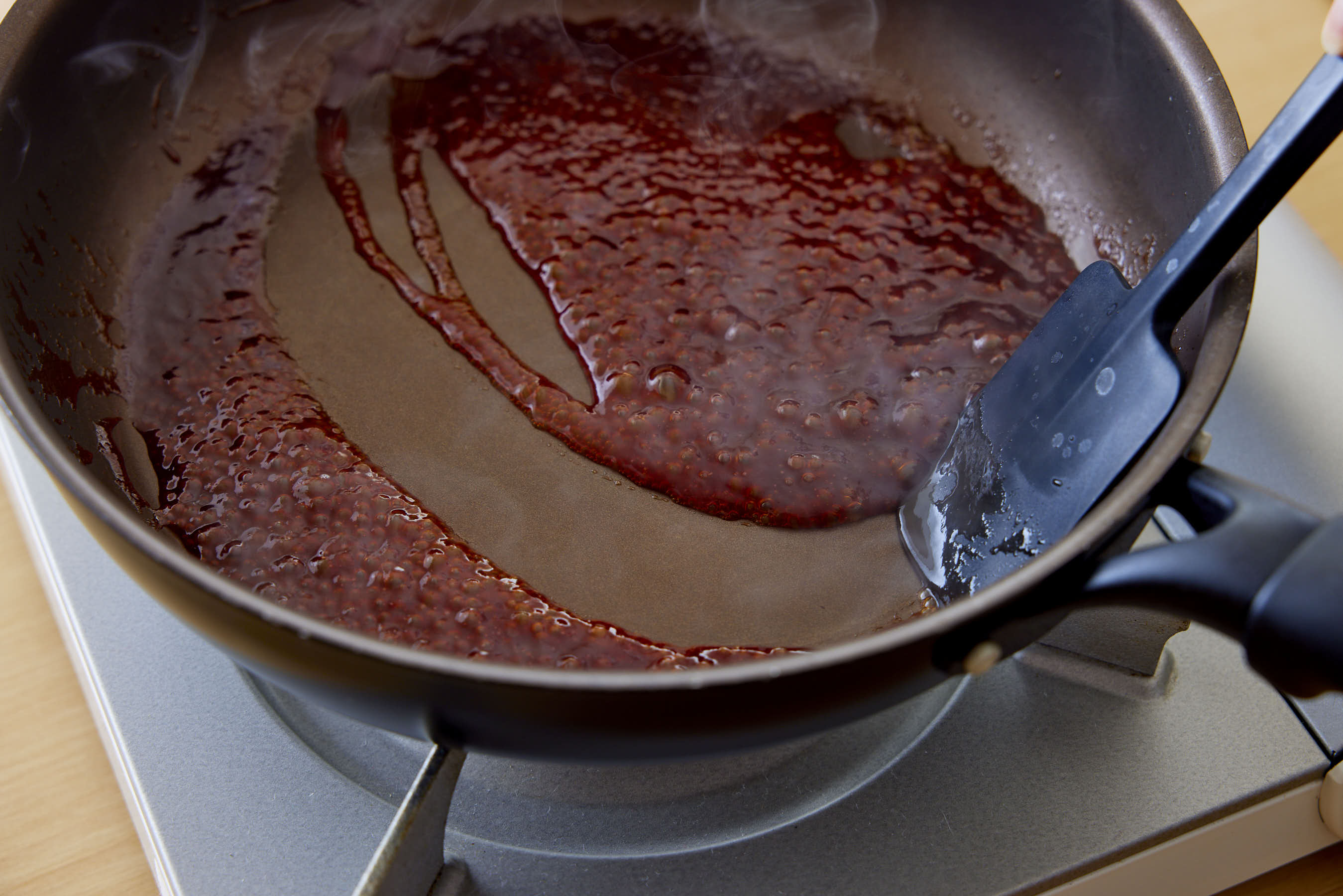 Small bubbles appear in a fry pan