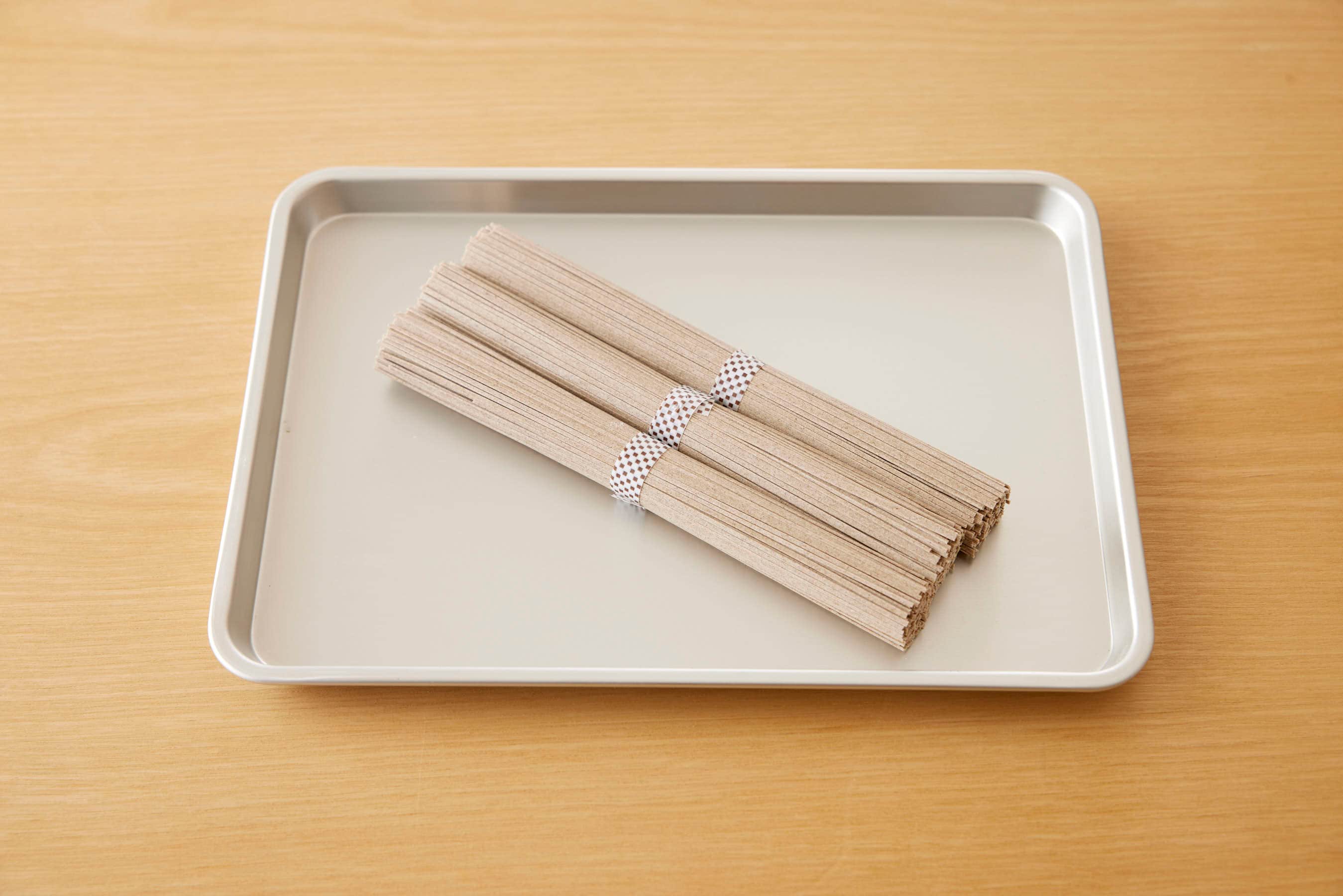 Dried soba noodles on a trey