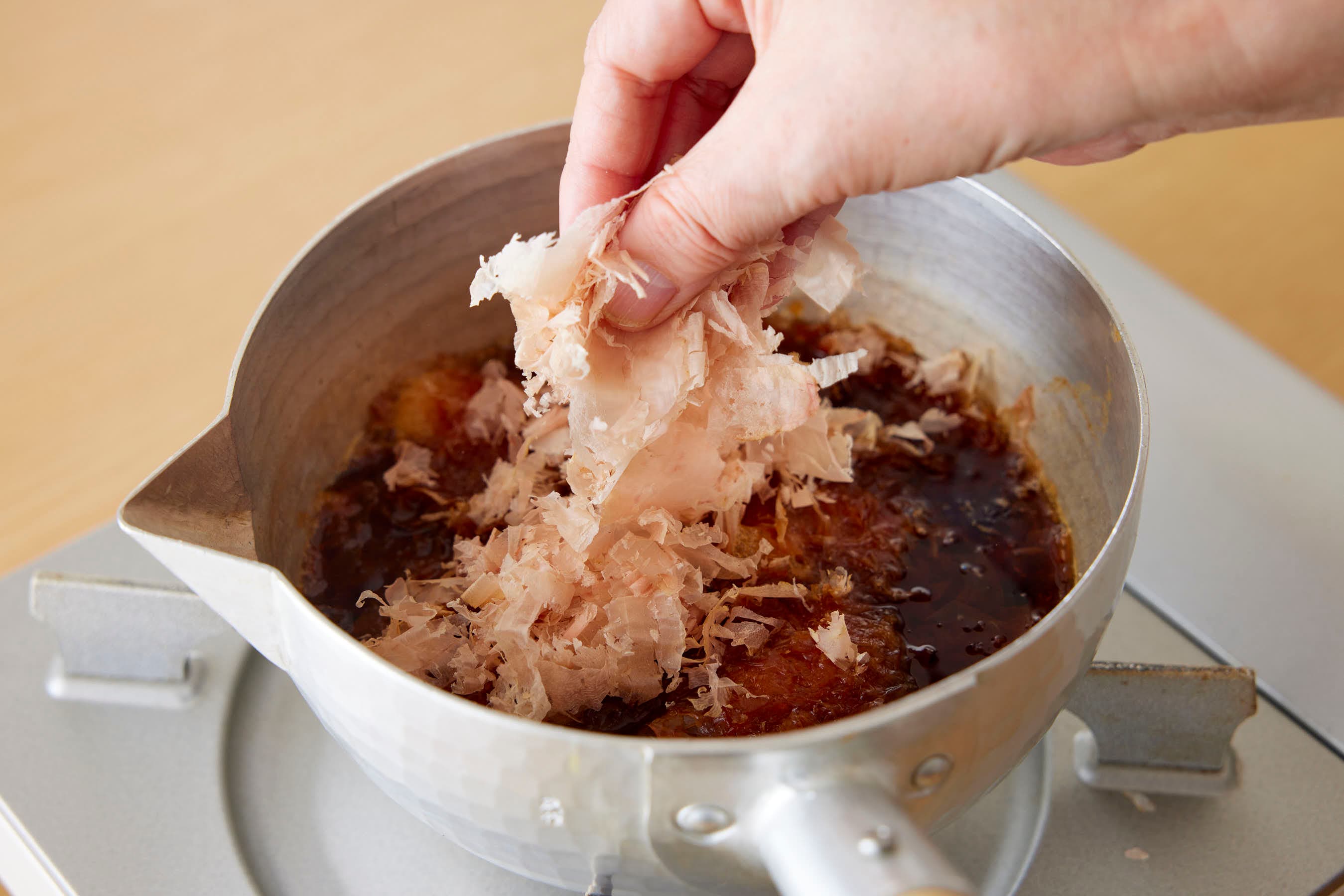 Adding katsuobushi to the pot