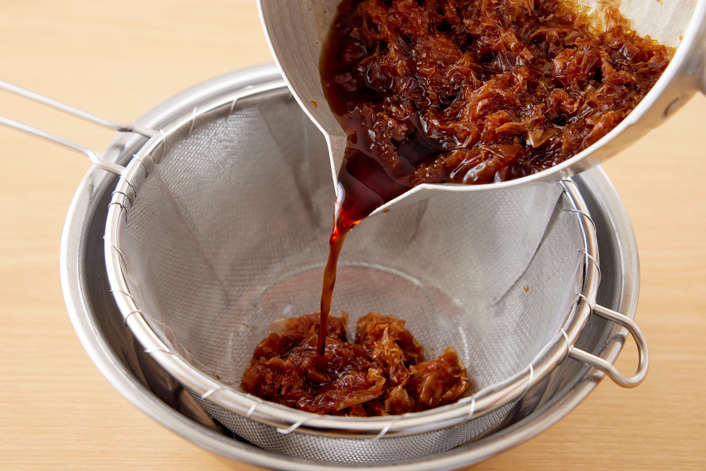 Strain katsuobushi through a strainer